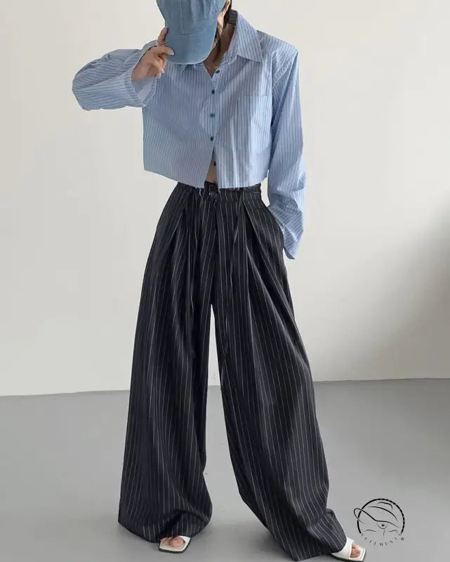 Light blue pinstriped cropped shirt with loose drooping casual work pants