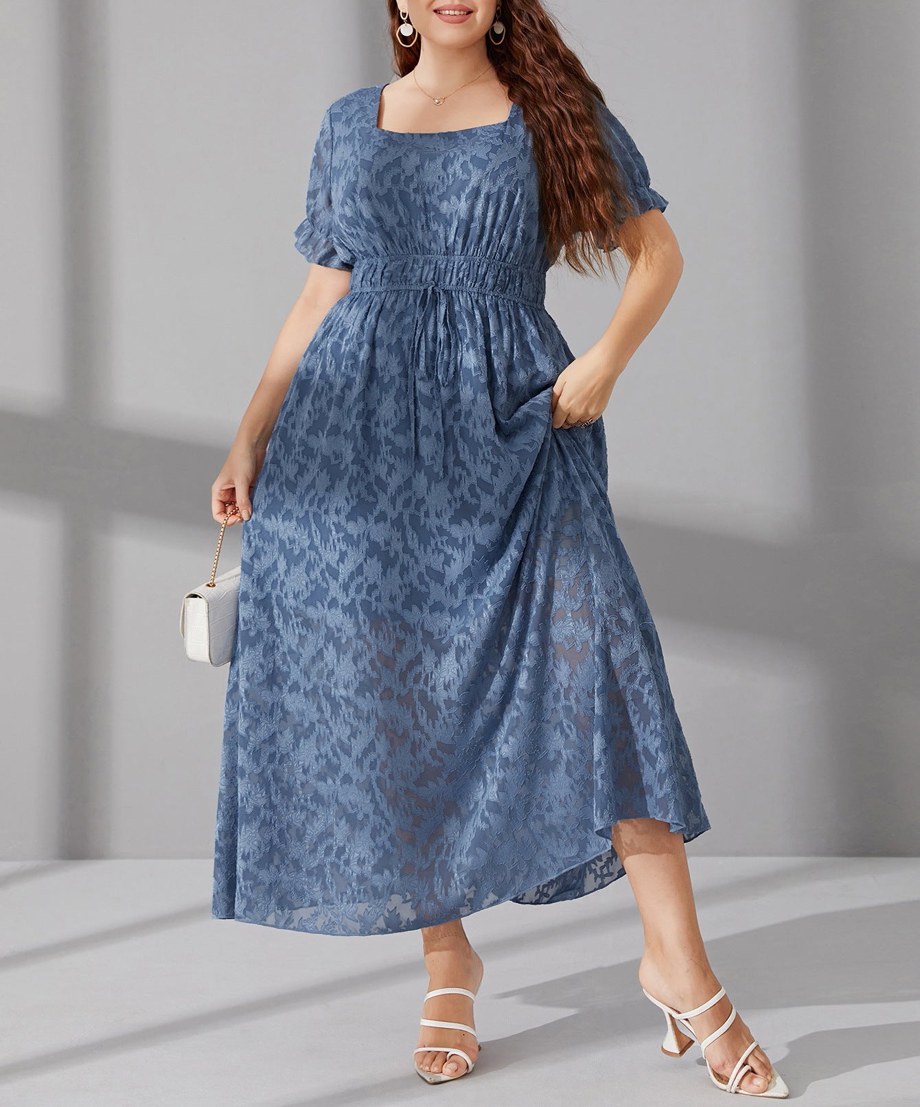 Elegant long blue midi dress with elastic waist, puff sleeves, and subtle pattern
