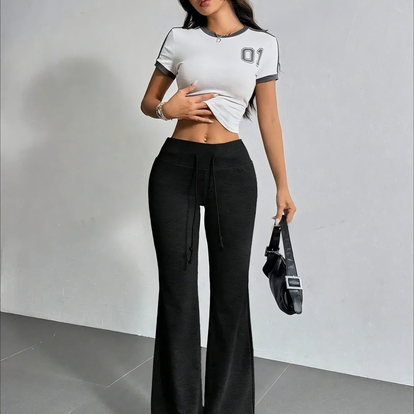 Woman wearing High Waist Casual Solid Color Bell Bottom Pants in trendy fashion