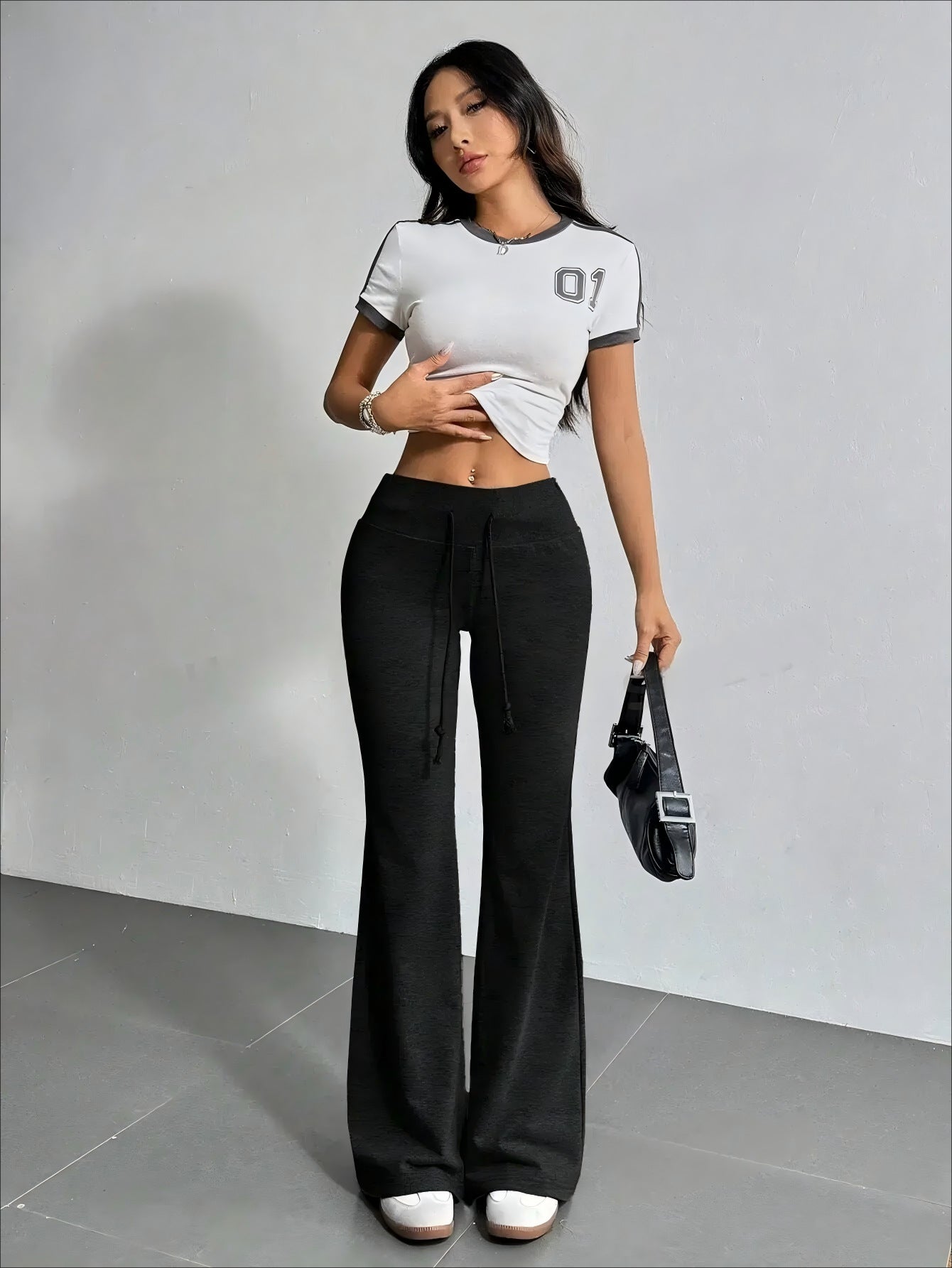 Woman wearing High Waist Casual Solid Color Bell Bottom Pants in trendy fashion