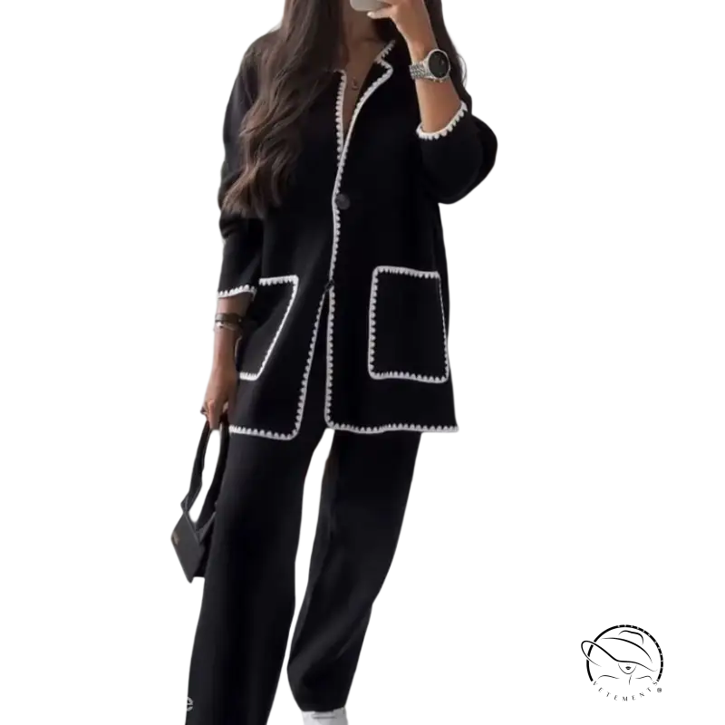 Chic black blazer with white trim and wide-leg trousers in Vetements style