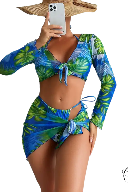 Four piece lace up swimsuit in blue and green tropical leaf print with long sleeves