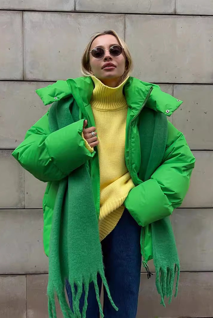 Woman in a bright green puffer coat showcasing trendy langry fashion ملابس