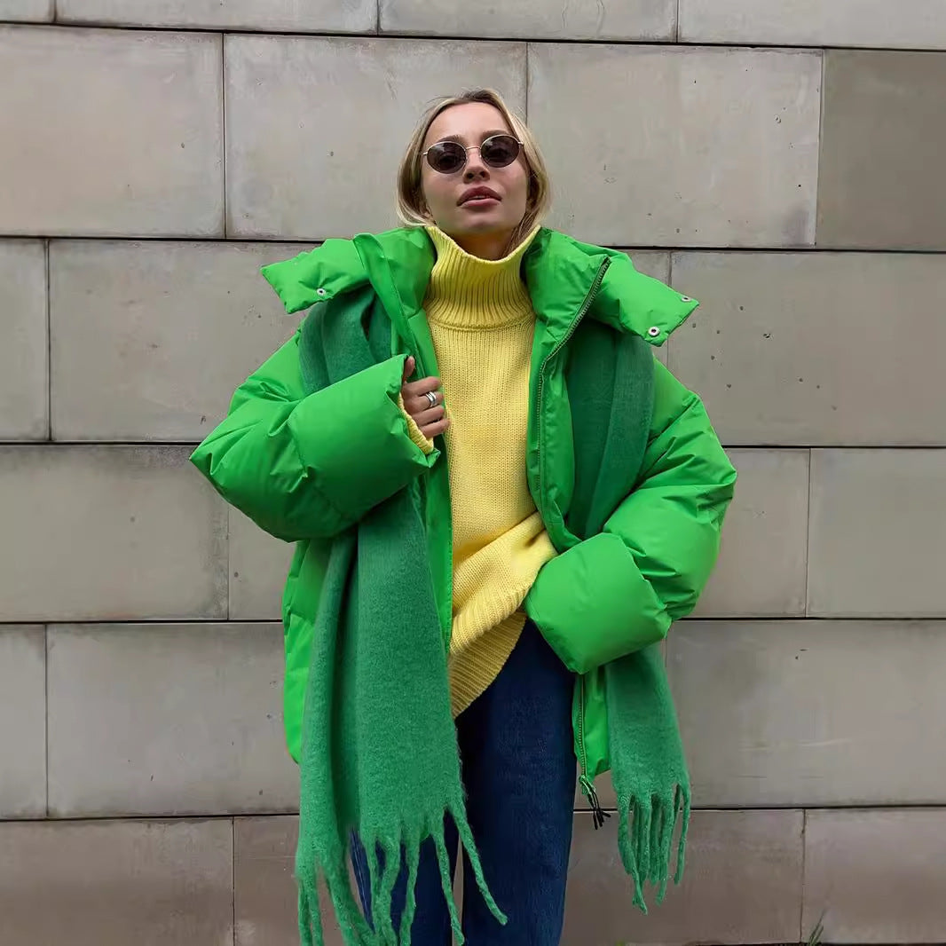 Woman in a bright green puffer coat showcasing trendy langry fashion ملابس