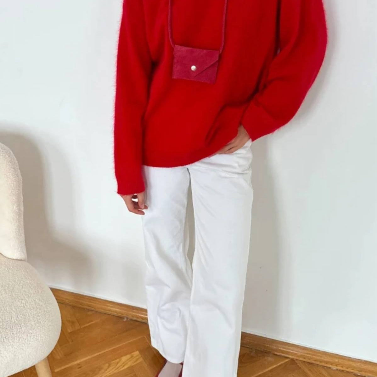 Red wool alpaca oversized sweater with pink accents and pocket detail