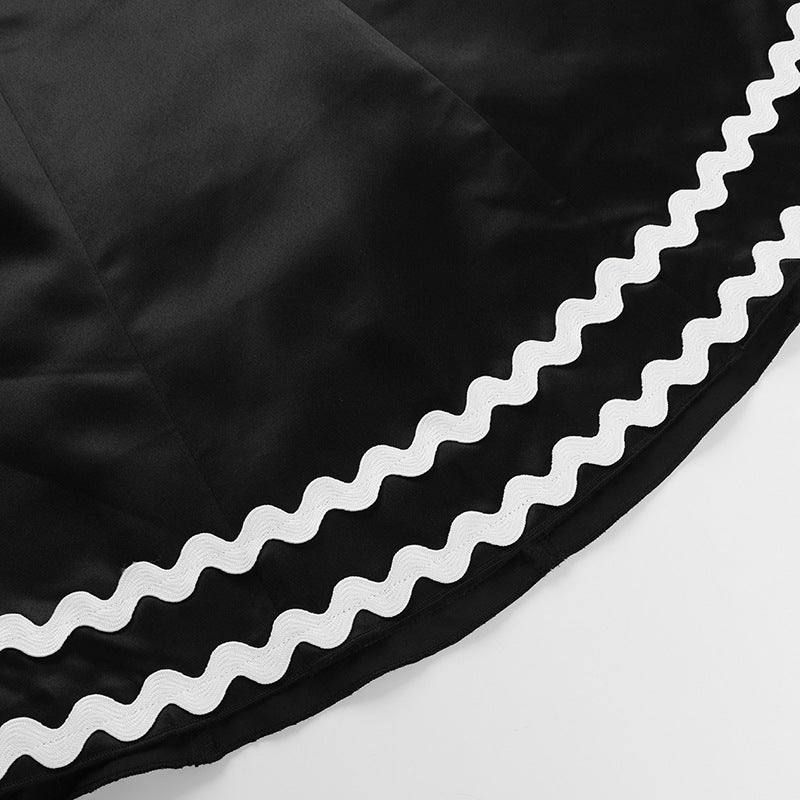 Black fabric with white scalloped trim on elegant summer line dress for women