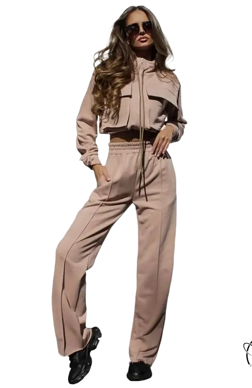 Woman in elegant vetements suit with long sleeve beige tracksuit