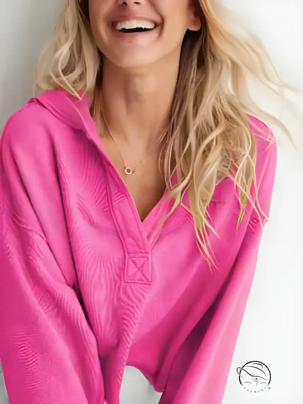 Bright pink langry fashion hooded sweatshirt with wavy blonde hair