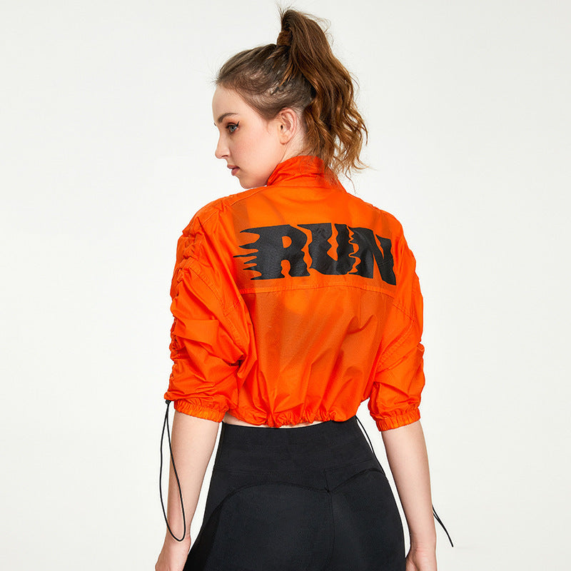 Orange cropped running jacket from Langry, ideal for casual fitness and yoga wear