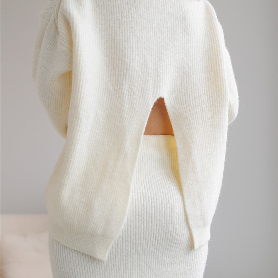 Cream-colored knit sweater and skirt set featuring back cutout in elegant fashion ملابس