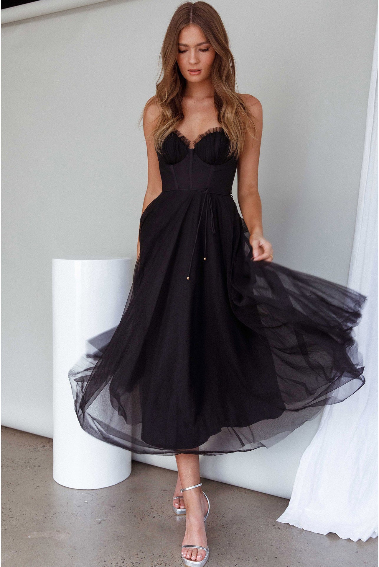 Elegant black midi dress from the ELEGANT SLING DRESS collection, perfect for sophisticated occasions