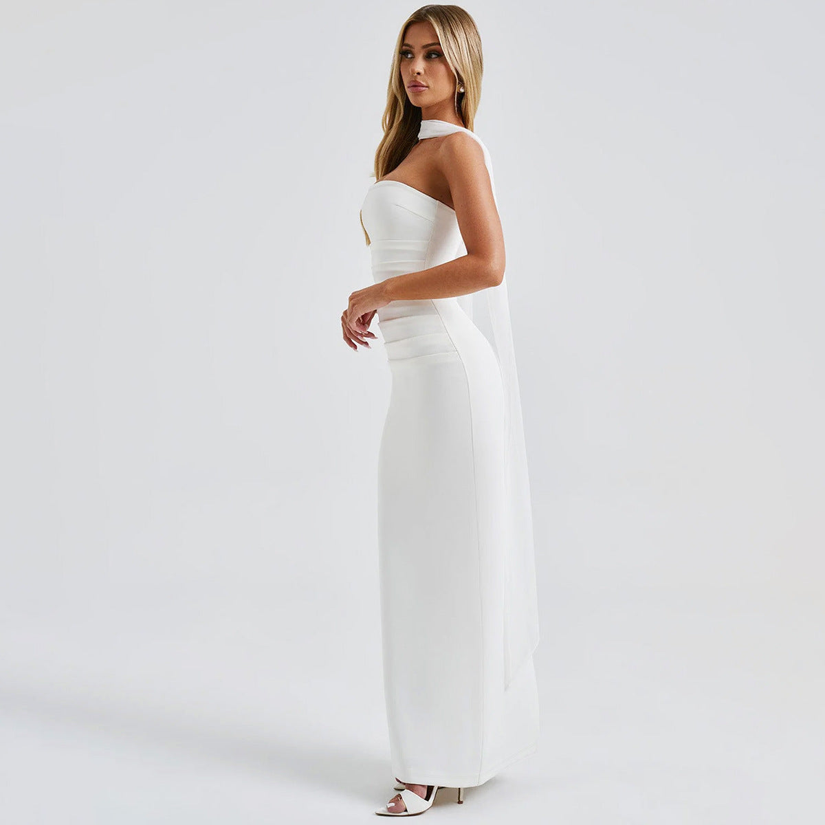 Elegant white one-shoulder gown from Fashion’s Gorgeous Winter Evening Dress collection