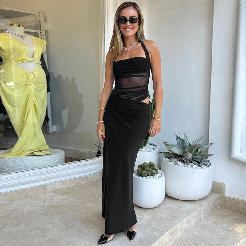 Woman in black halter dress showcasing the Stunning Halter Split Maxi Dress in fashion