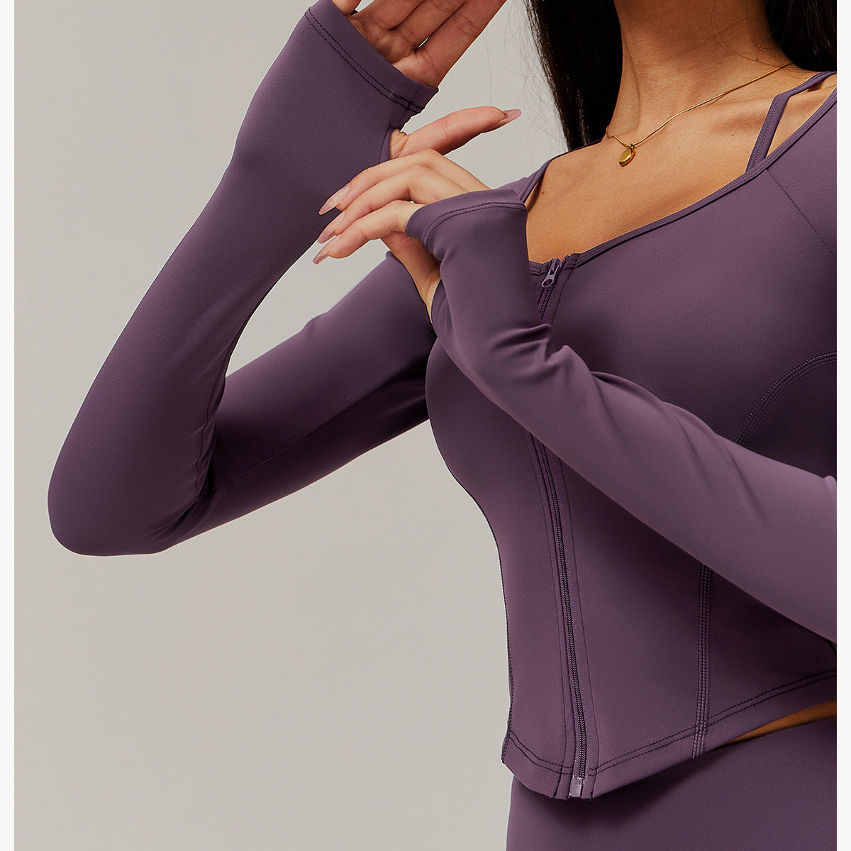 Purple long-sleeved athletic top with zipper for comfy fitness and yoga fashion ملابس