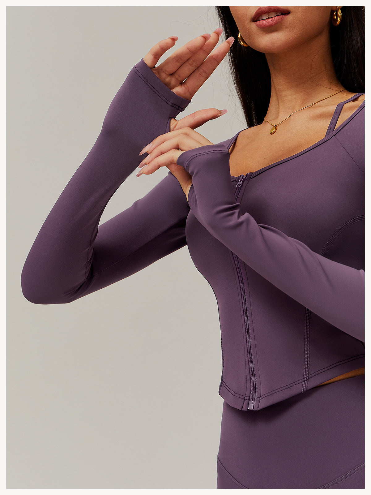 Purple long-sleeved athletic top with zipper for comfy fitness and yoga fashion ملابس