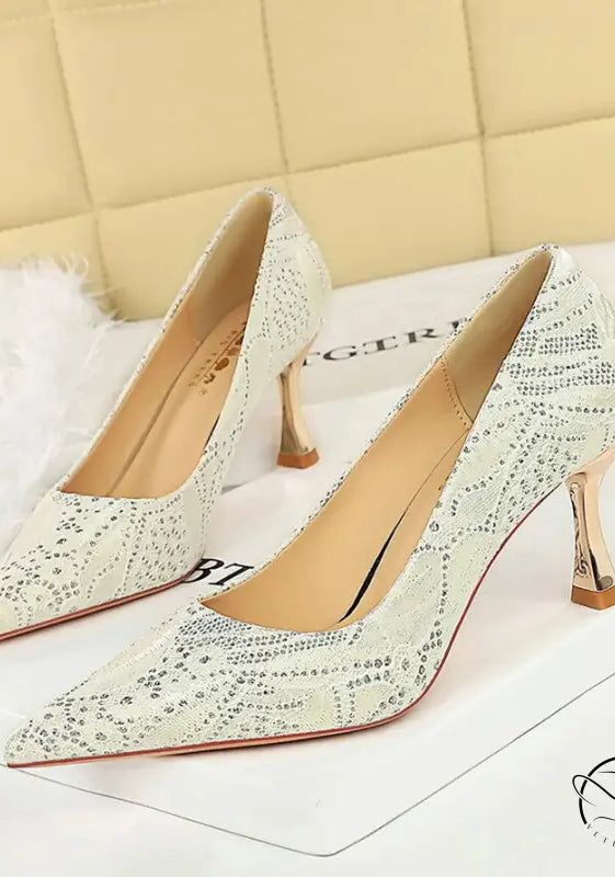 Elegant white snakeskin high heel pumps with rhinestone accents in langry fashion