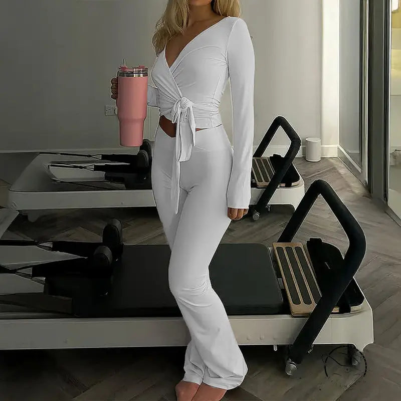 White langry fashion ملابس: long-sleeved wrap top and flared pants set