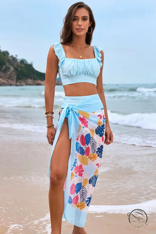 Gorgeous split bikini: light blue crop top and floral sarong with ruched details