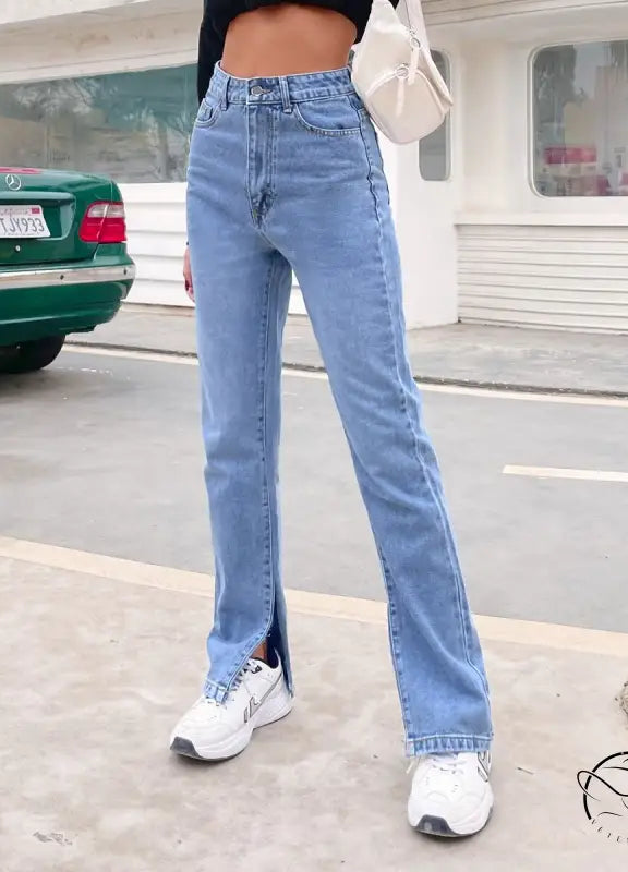 Light wash high-waisted Langry denim pants with split hems