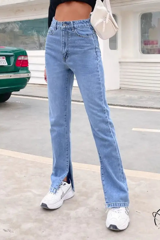 Light wash high-waisted Langry denim pants with split hems