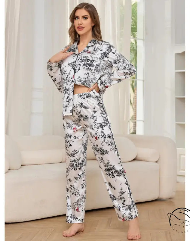 Woman in black and white floral winter long sleeved trousers home wear set