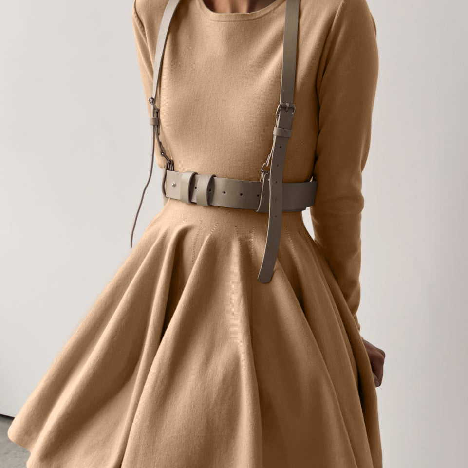 Beautiful woolen knitted dress featuring a tan long-sleeved design with harness belt