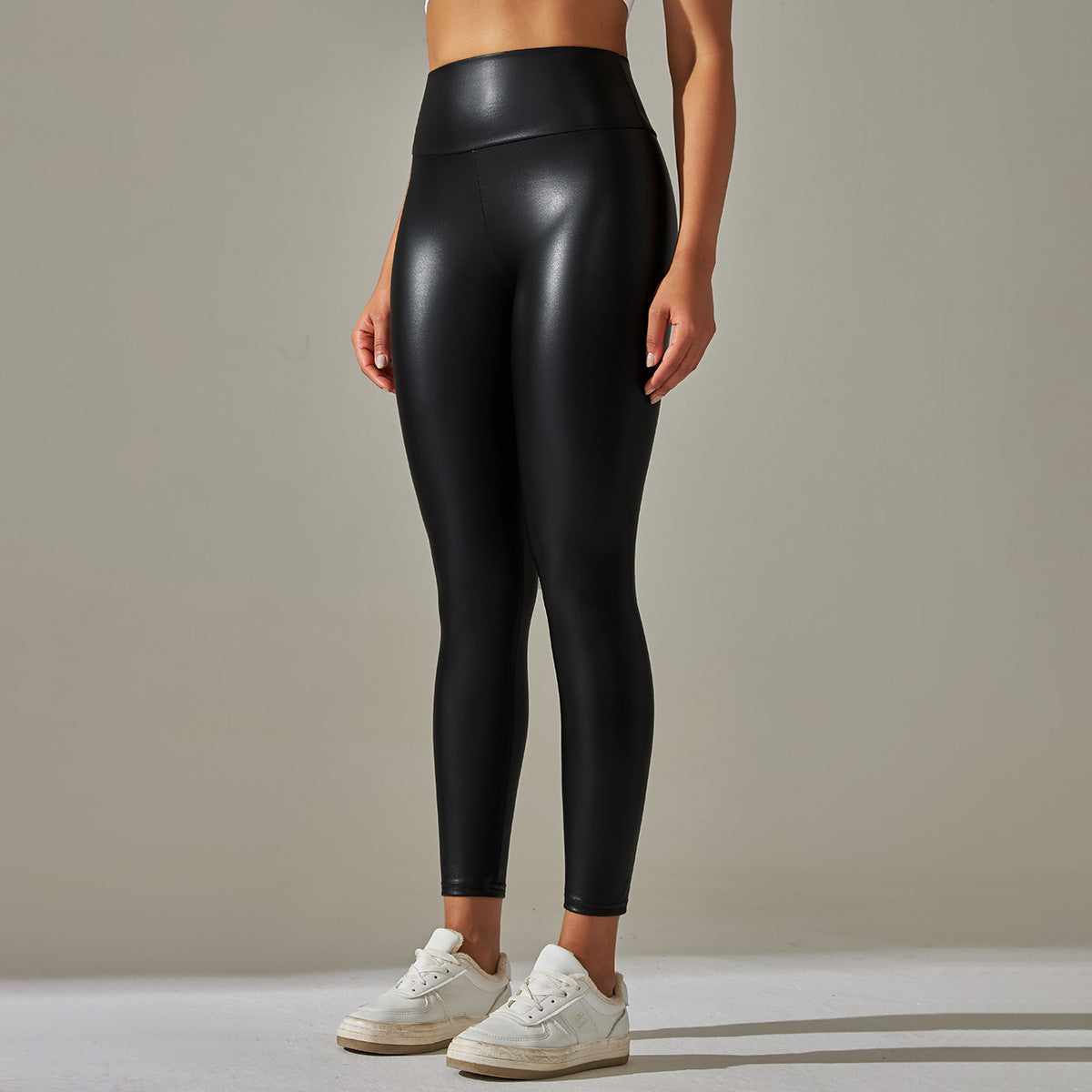 High waist faux leather leggings with white sneakers
