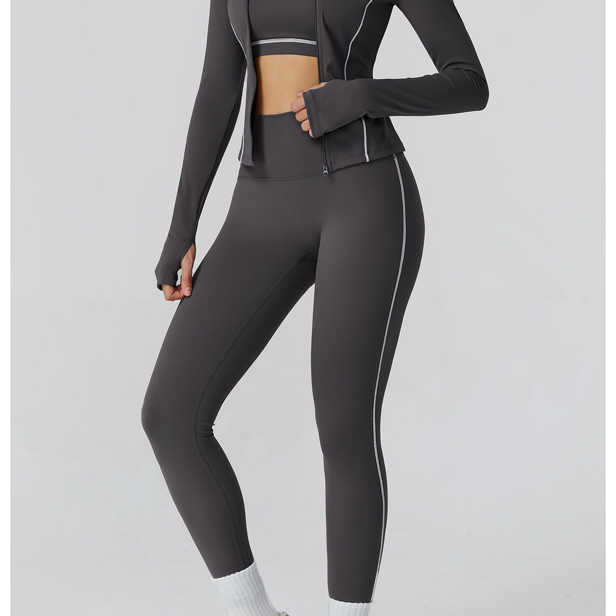 Charcoal gray Langry fashion leggings with white piping, zipper detail, Lululemon athletic wear