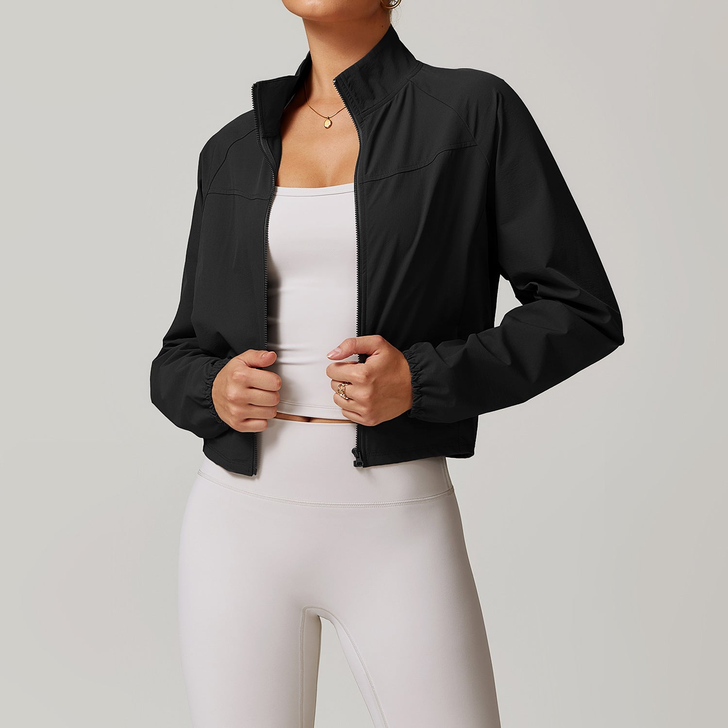 Black cropped bomber jacket over white athletic wear, ideal for Langry fashion ملابس