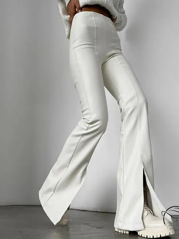 Winter faux leather slit pants with white split-hem flared design