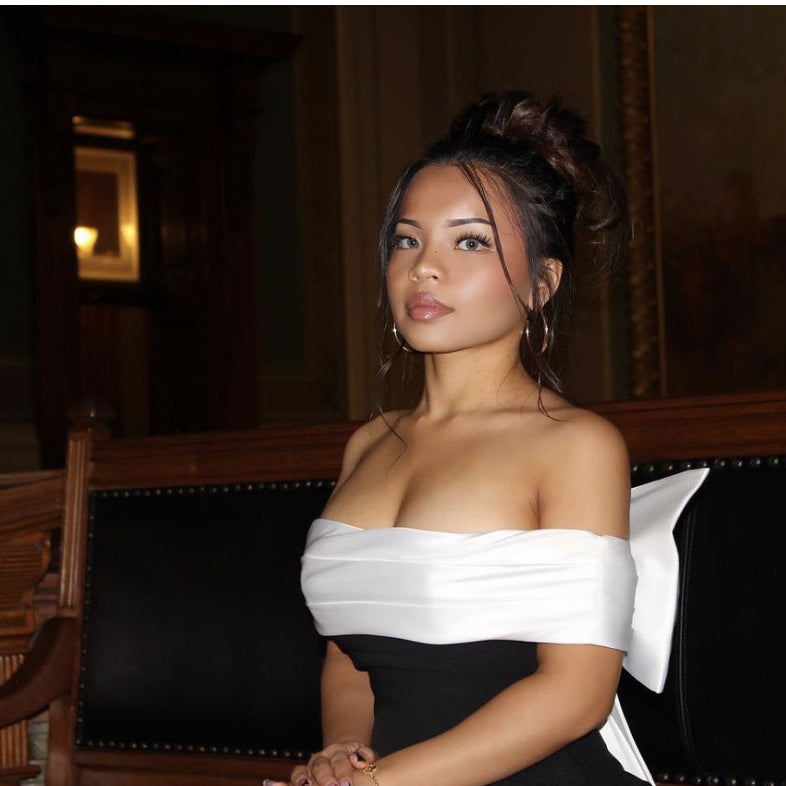 Elegant black and white swing dress showcasing stylish ملابس fashion for sophisticated looks