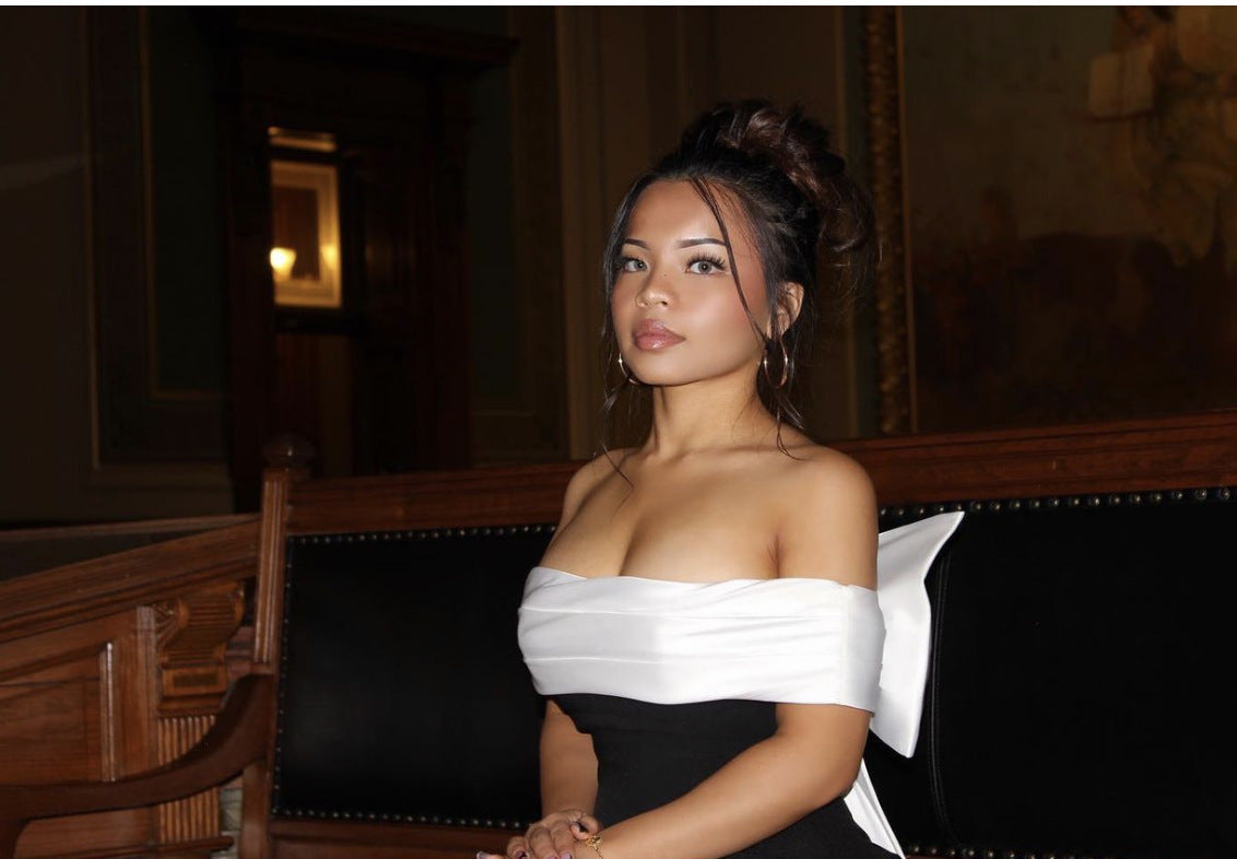 Elegant black and white swing dress showcasing stylish ملابس fashion for sophisticated looks