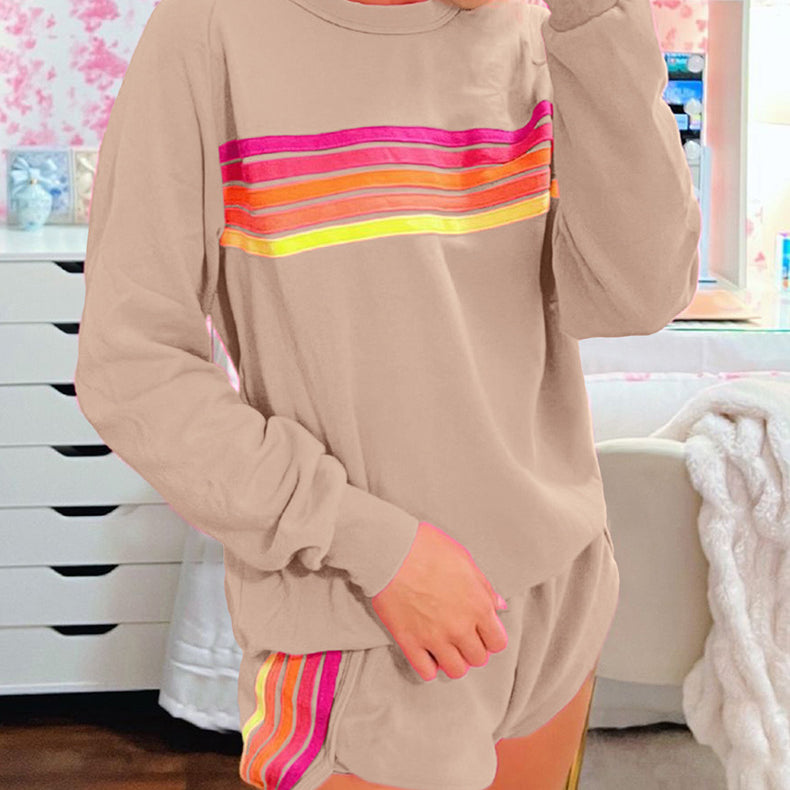 Beige loungewear set featuring rainbow stripes in pink, orange, and yellow for casual fashion