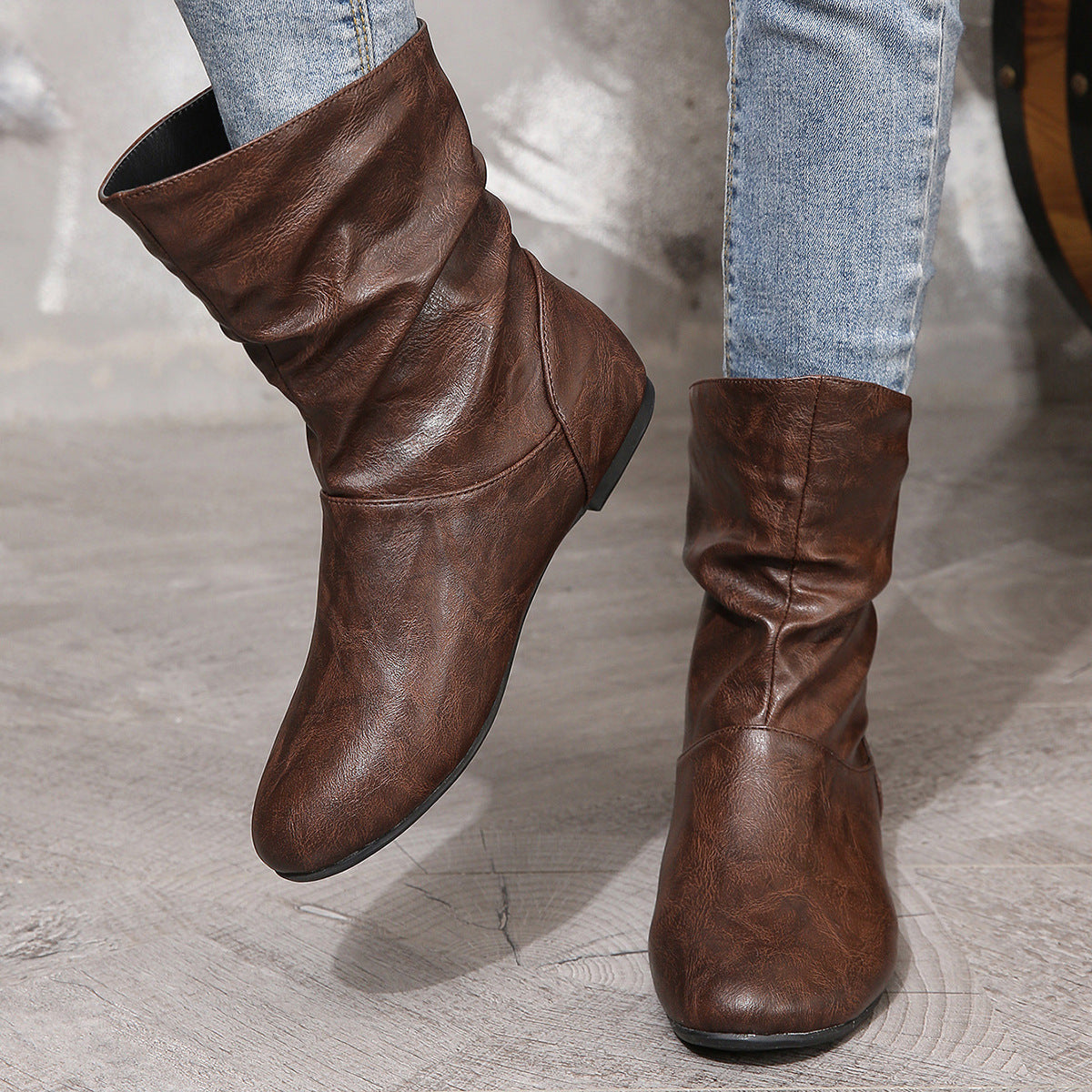 Brown leather ankle boots with a slouchy design, perfect low heel faux leather boots