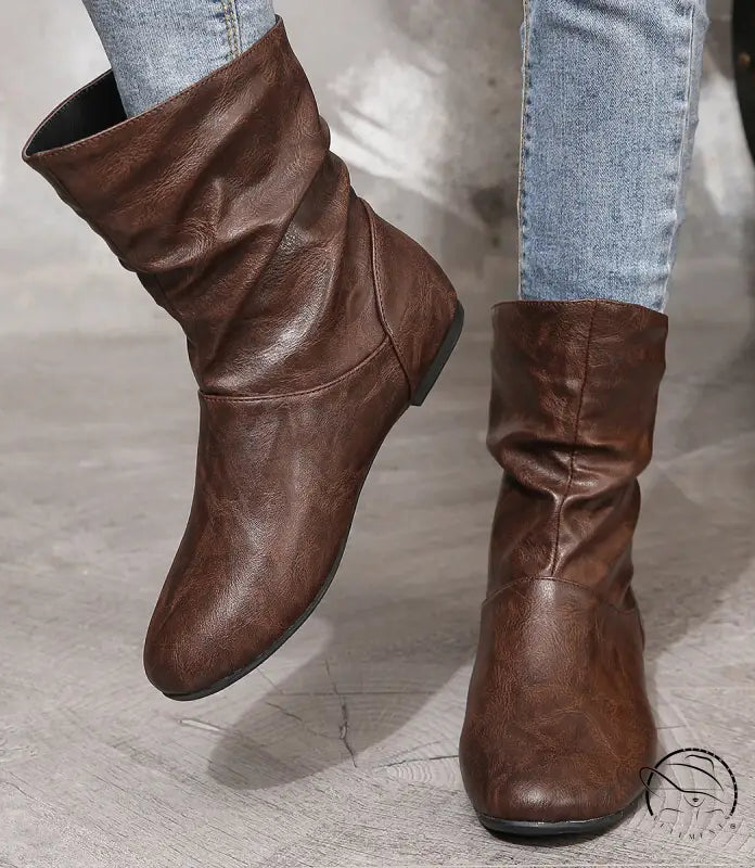 Brown low heel faux leather boots with slouchy wrinkled ankle design