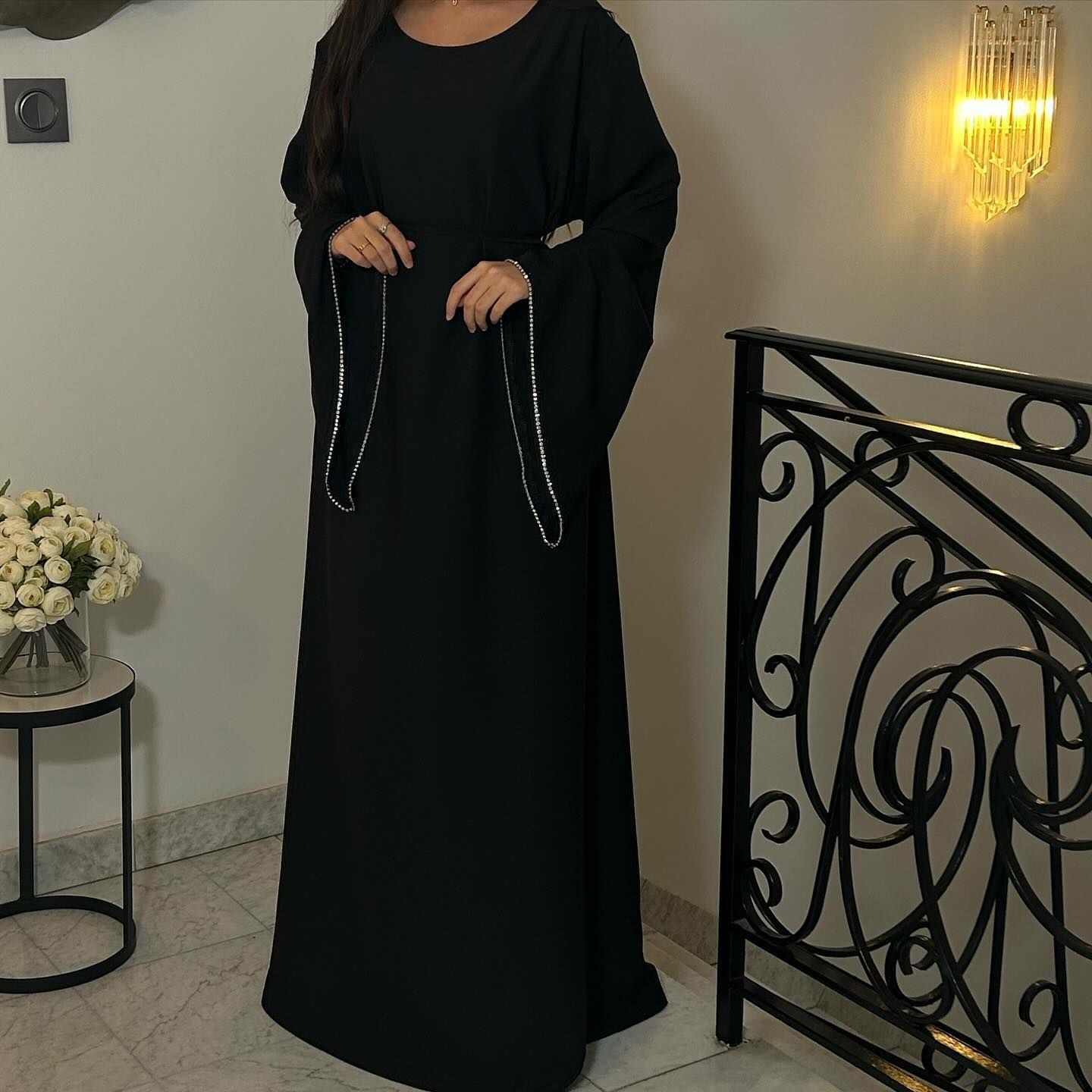 Elegant black abaya with embellished sleeves from the fashion collection ملابس