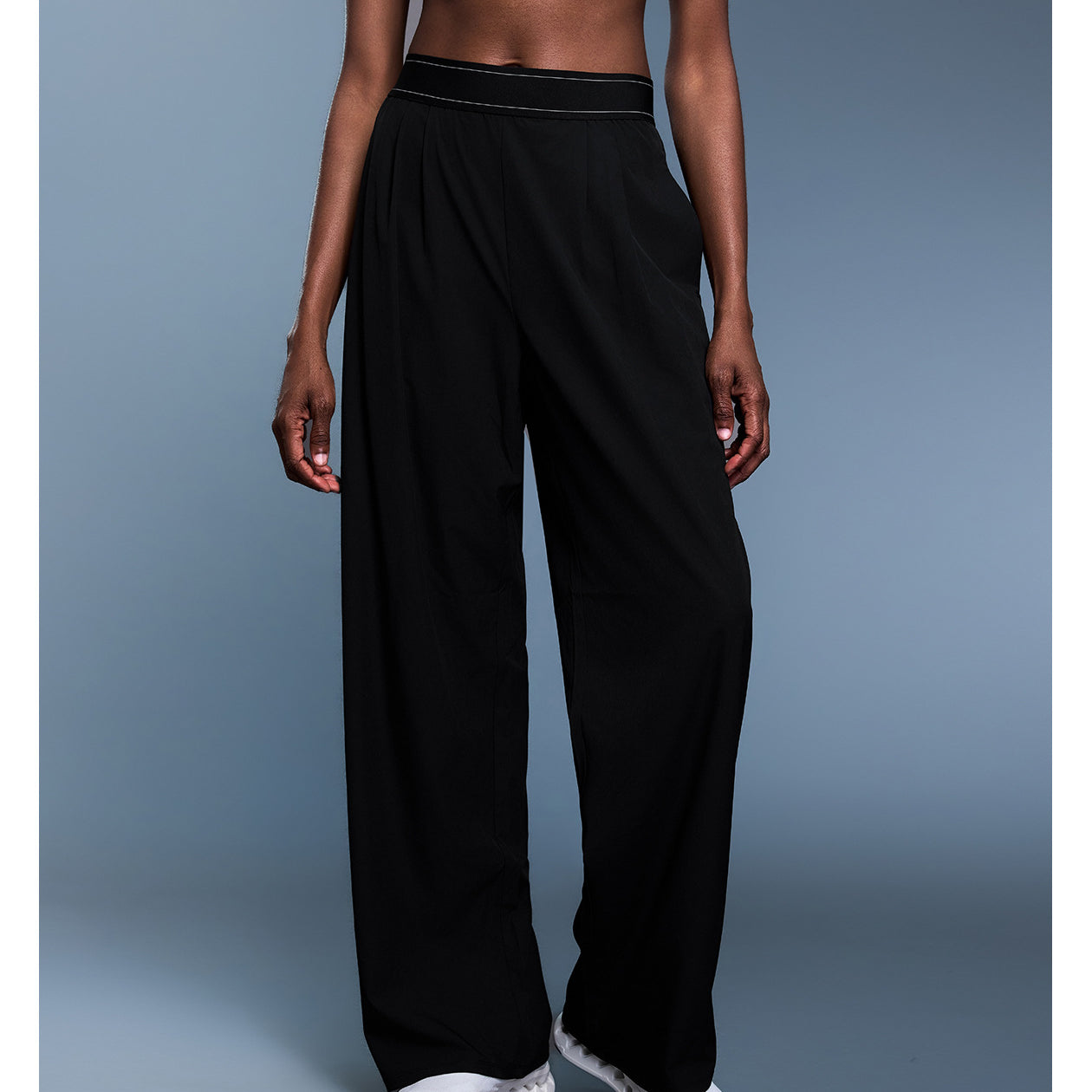 Black wide-leg langry fashion pants with white piping and elastic waistband