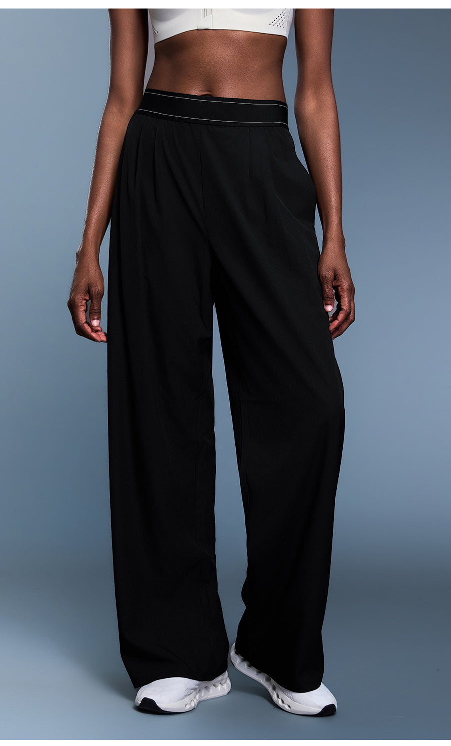 Black wide-leg langry fashion pants with white piping and elastic waistband