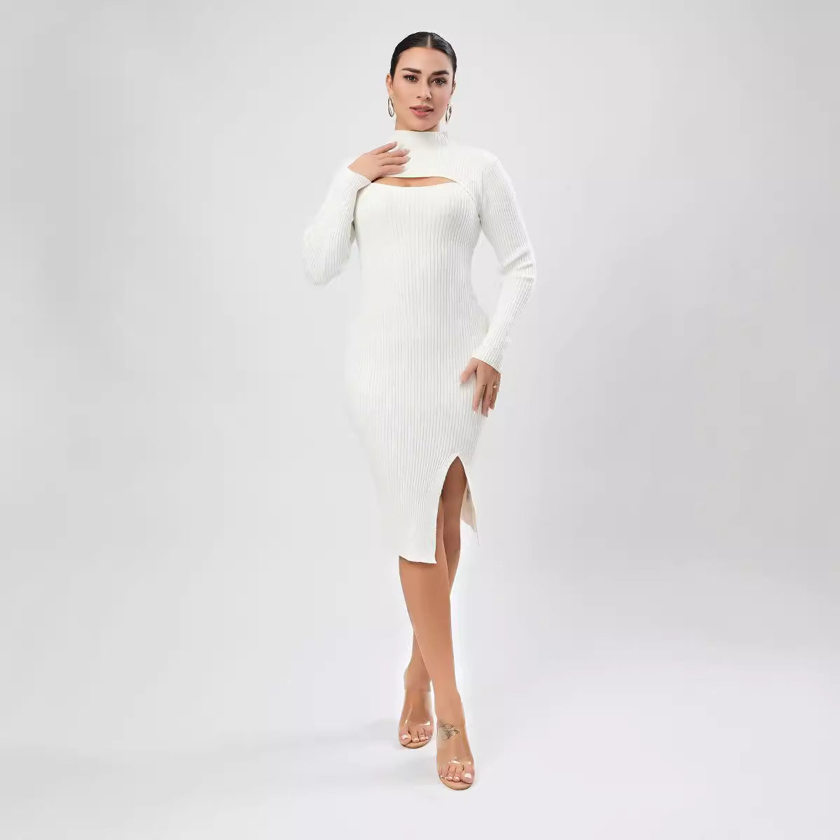 Woman in a white ribbed knit dress, showcasing elegant fashion for evening events