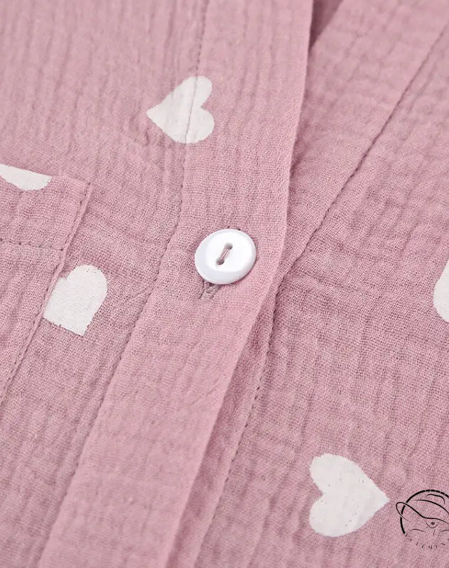Pink muslin pajamas set with white heart patterns and button