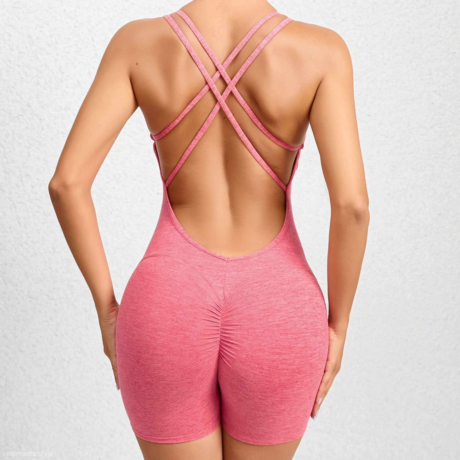 Pink athletic romper with crisscross straps from Peach Yoga Jumpsuit collection