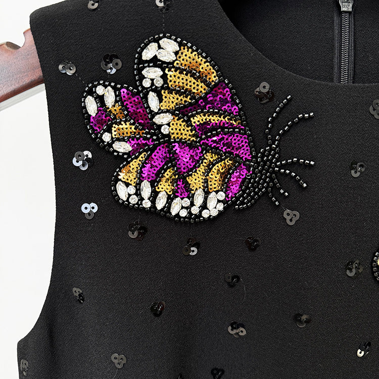 Black dress with beaded butterfly detail, elegant fashion for modern ملابس styles