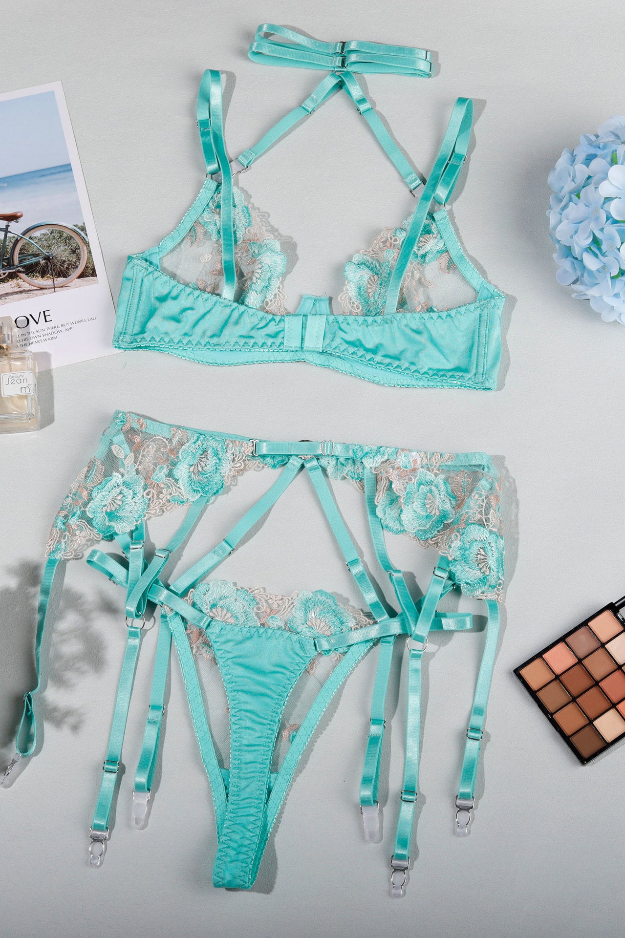 Mint green lingerie set with strappy details and garter attachments for elegant fashion ملابس