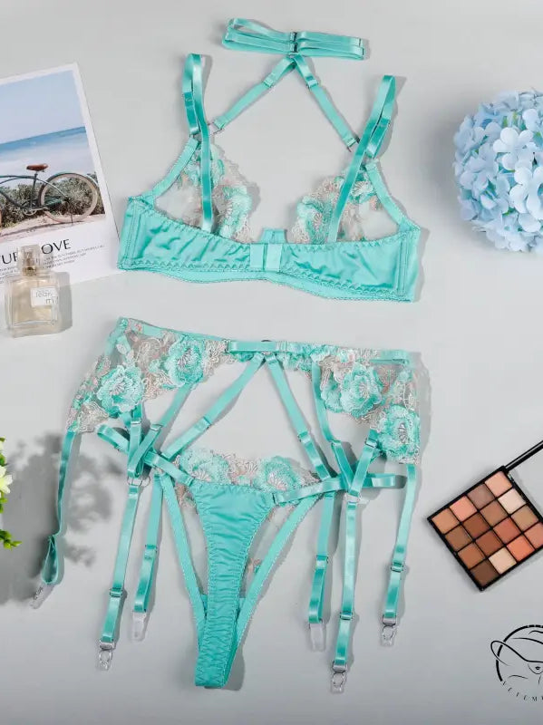 Beauty midnight lingerie: mint green set with strappy details and garters
