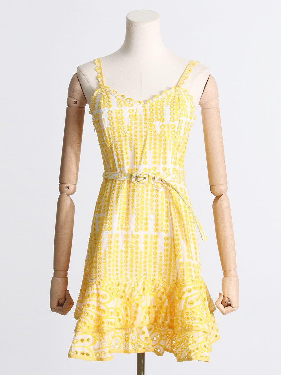 Yellow and white patterned sundress with spaghetti straps, ideal for summer fashion ملابس