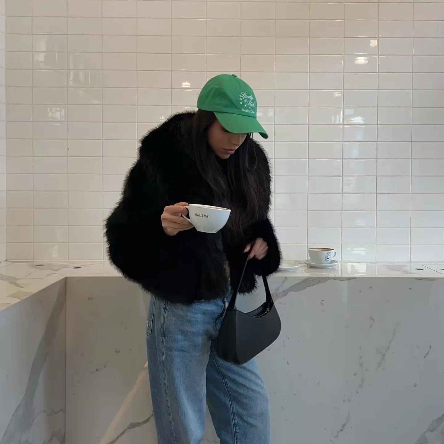 Langry faux fur fashion: green cap with logo, black strap, leather bag