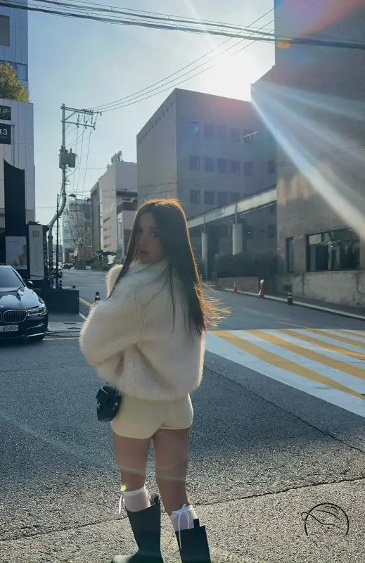 Short loose casual faux fur coat in cream color with green boots and white socks