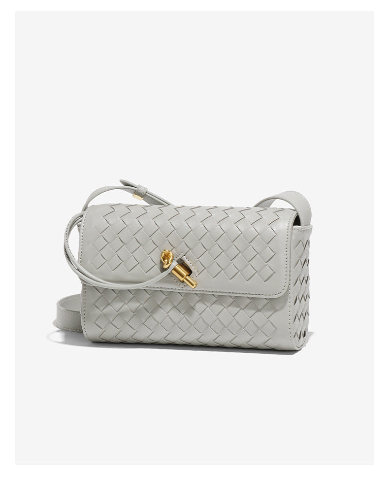 Gray woven crossbody bag with gold clasp, perfect for langry fashion and stylish ملابس