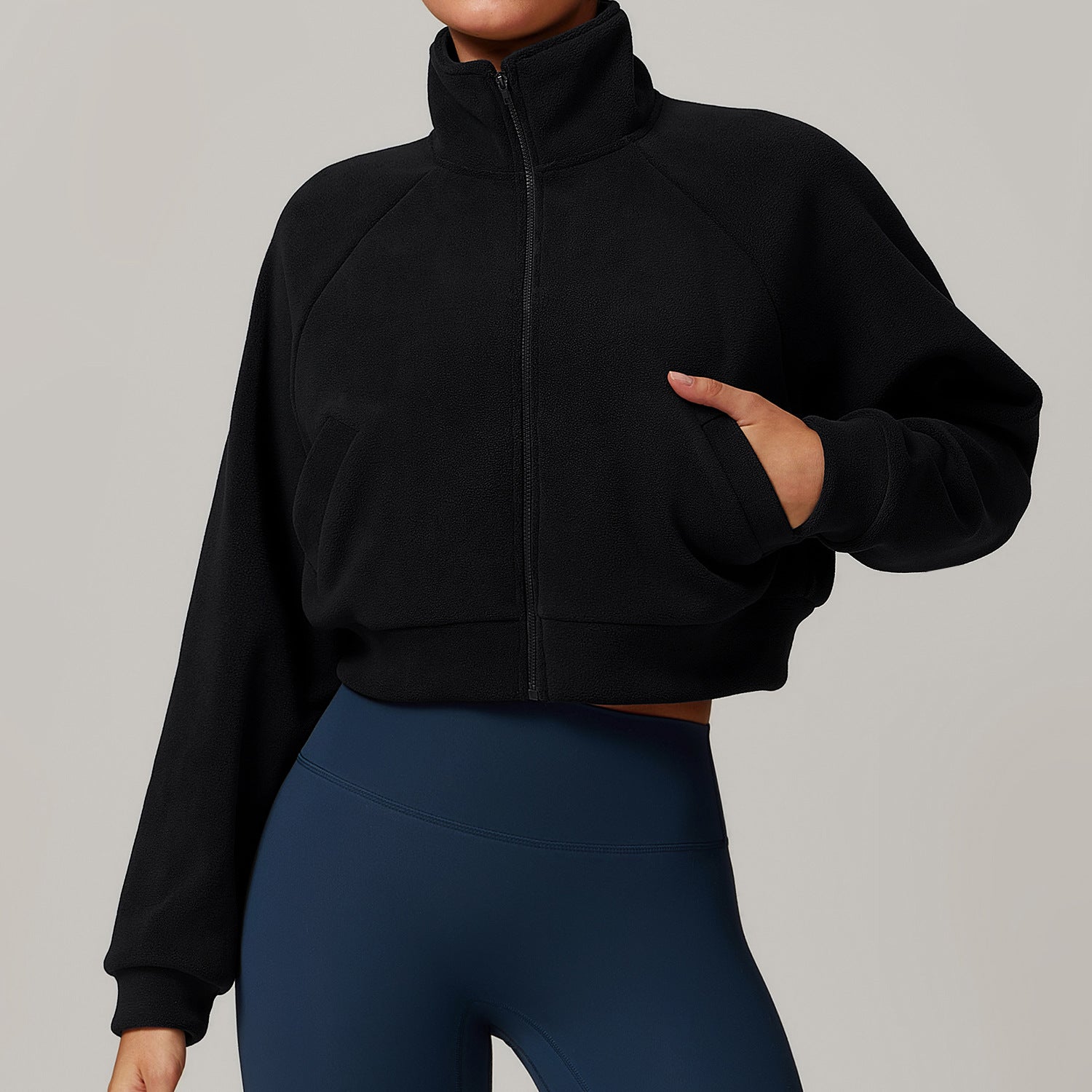 Cropped black zip-up fleece jacket with high collar, enhancing langry fitness fashion