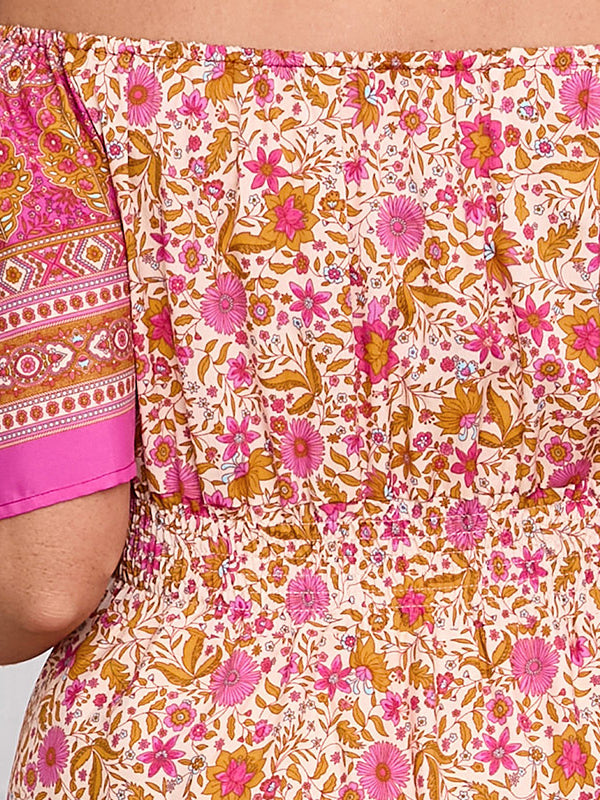 Elegant bohemian dress featuring floral off-the-shoulder design and patterned sleeves